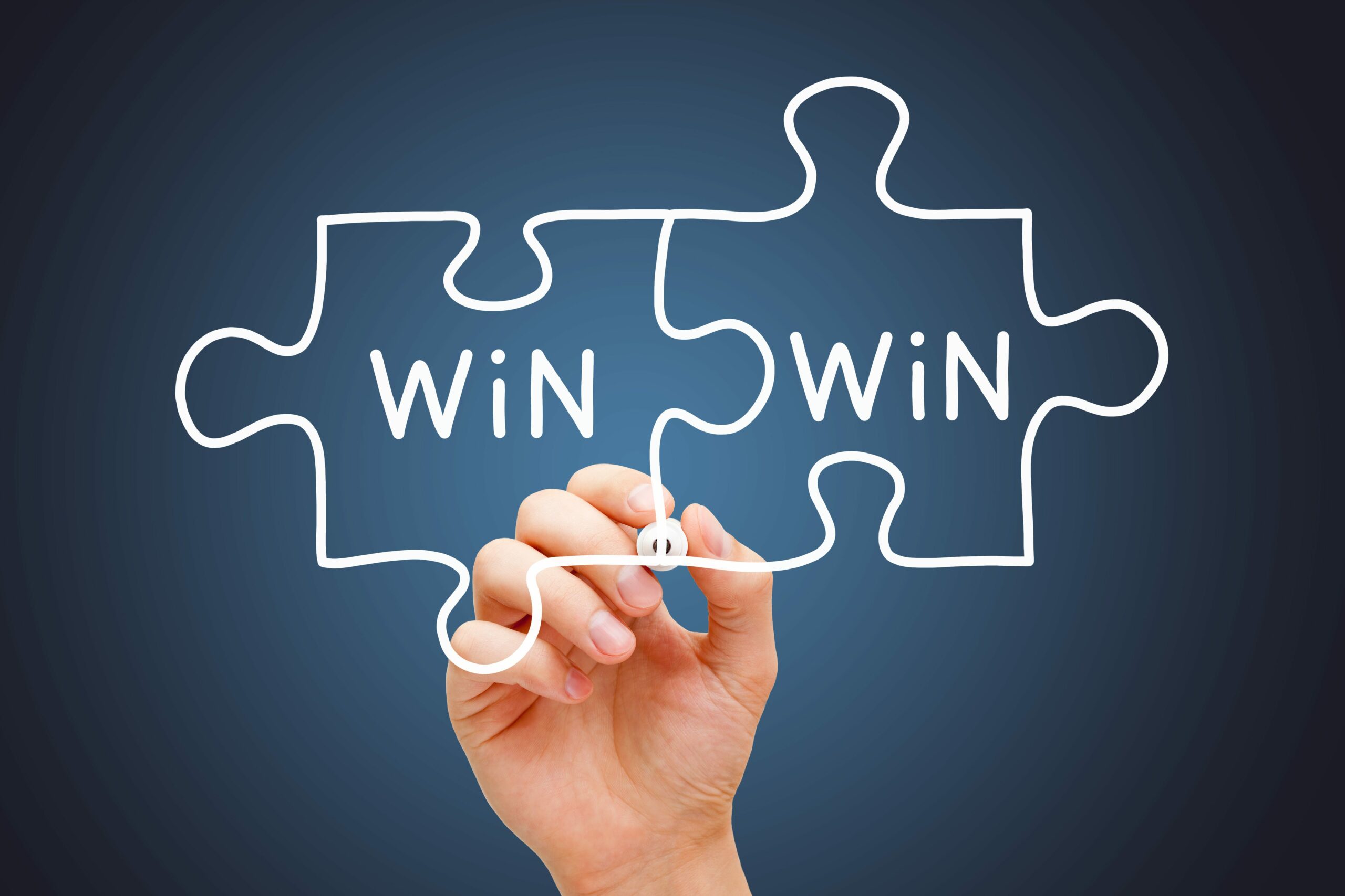 Hand drawing Win-Win jigsaw puzzle business concept with white marker on transparent wipe board.